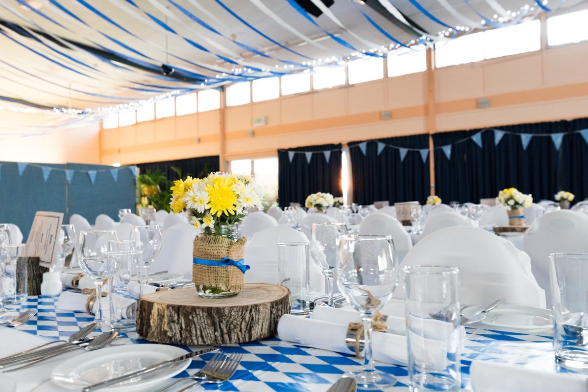Elegant event décor with floral arch and draping