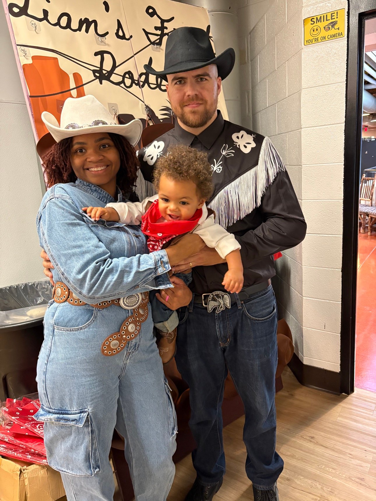 Family at a first birthday rodeo celebration